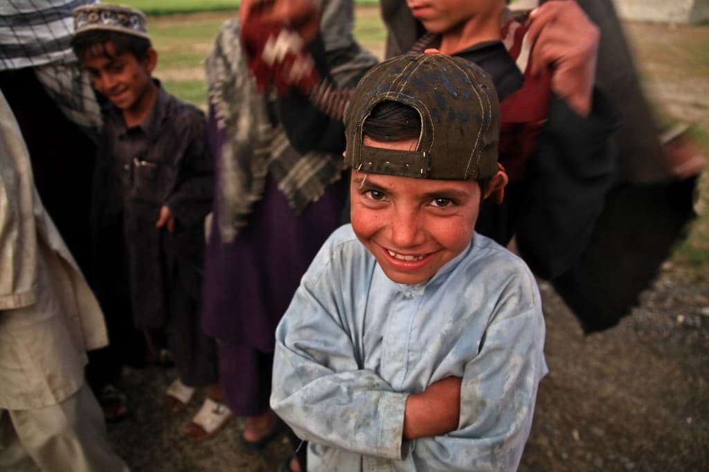 Smiling child with friends in Jordan